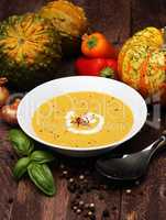 Pumpkin soup on a wooden table