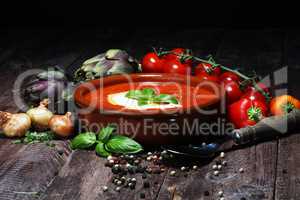 fresh tomato soup in a white bowl