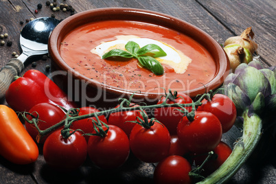fresh tomato soup in a white bowl