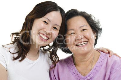 Senior mother and adult daughter headshot
