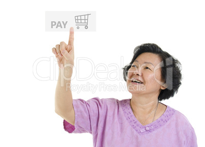 Senior adult woman pointing pay button
