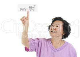 Senior adult woman pointing pay button