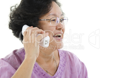 Senior adult woman talking on phone