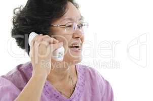 Senior adult woman talking on phone