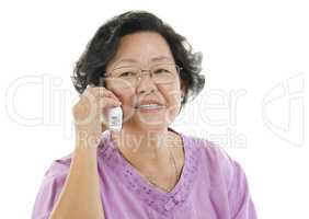 Senior adult woman talking on telephone