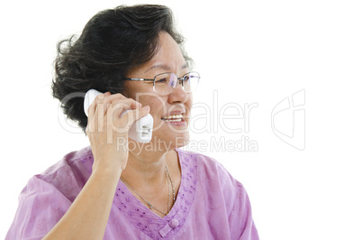 Senior adult woman calling on phone