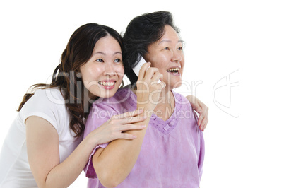 Mother and daughter calling on phone