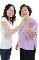 Mother and daughter high five
