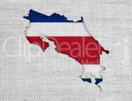 Karte und Fahne von Costa Rica auf altem Leinen