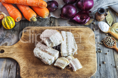 Fresh salted pork fat on a kitchen board