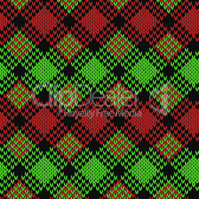 Seamless knitted pattern in black, green and red colors