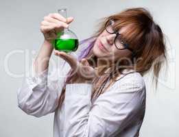 Scientist woman with green liquid