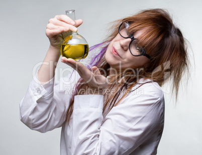Scientist woman with yellow liquid