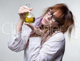 Scientist woman with yellow liquid