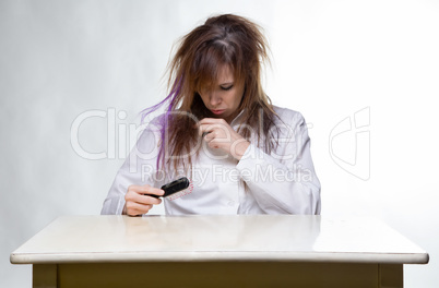 Shaggy woman brushing her hair