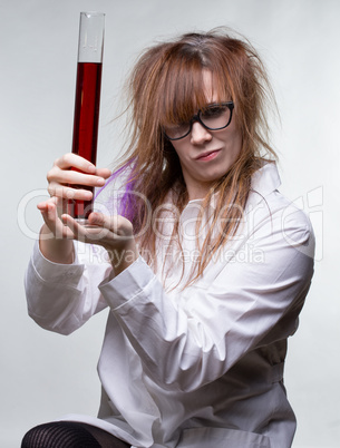 Scientist pride woman with red liquid