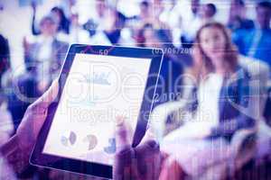 Businessperson using digital tablet during meeting