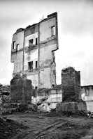 Pieces of Metal and Stone are Crumbling from Demolished Building