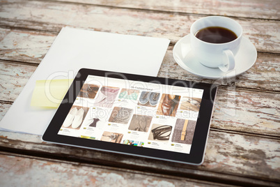 Composite image of overhead of tablet on desk