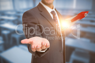 Composite image of businessman presenting 3D