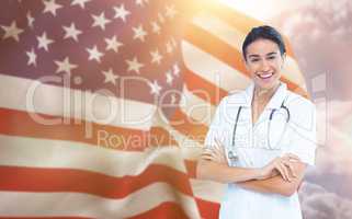 Composite image of portrait of smiling female doctor standing arms crossed