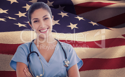 Composite image of smiling female doctor looking at camera