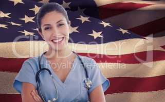 Composite image of smiling female doctor looking at camera