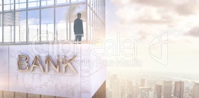 Composite image of businessman standing