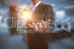Composite image of businessman showing his empty hand 3D
