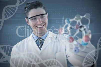 Composite image of happy scientist experimenting molecule structure