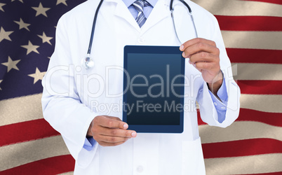 Composite image of a doctor showing digital tablet