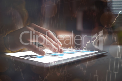 Woman using tablet on a wooden table