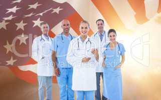 Composite image of portrait of confident female doctor with team over white background