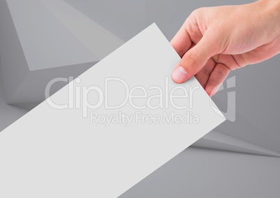 Composite image of Hand holding paper note against a neutral background