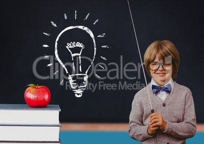 Composite image of kid at school against a blackboard with lightbulb