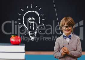 Composite image of kid at school against a blackboard with lightbulb