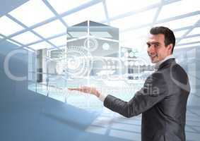 Composite image of business man presenting digital buildings projects