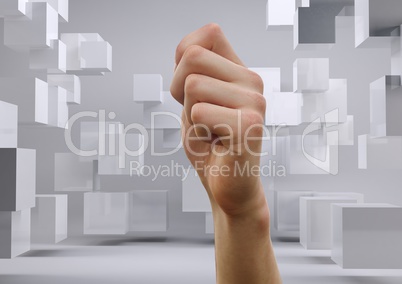 Composite image of fist against futuristic white cubes