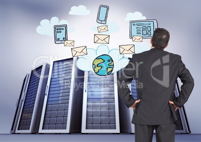 Composite image of Businessman Standing and  looking at icons against big folders in background