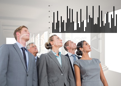 Business Group Standing looking at Graph against a grey background