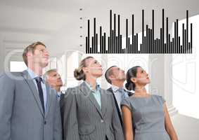 Business Group Standing looking at Graph against a grey background