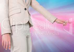 Businesswoman Hand pointing against a colorful background