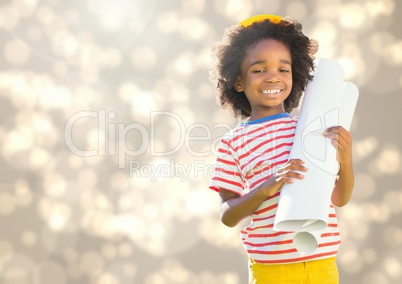 Happy Kid Boy holding paper against shining background
