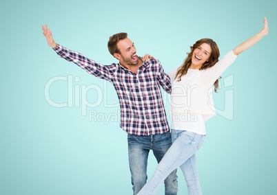 Happy Couple Having Fun against a blue Background