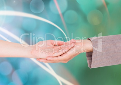 Composite image of two Hands holding each others against a green background