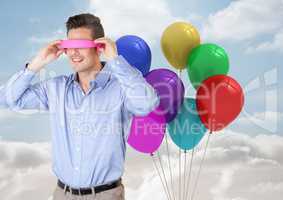 Man using VR Having fun with balloons against sky Background