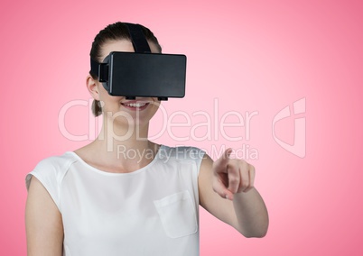 Happy Woman using VR Helmet against a pink Background