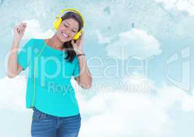 Woman with headphones against sky against a blue background