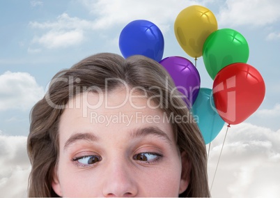 Funny Woman with Balloons Playing with her eyes against a sky background