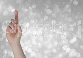 Composite image of hand Pointing bright Sparkles